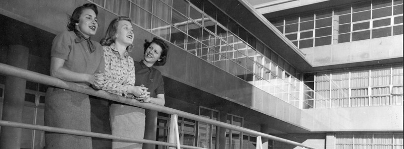 1950s women looking out from balcony
